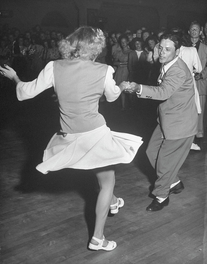 Couples Dancing In A Jitterbug Contest by Peter Stackpole