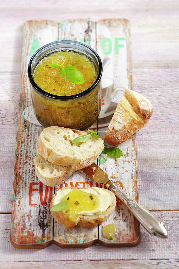 Courgette And Pineapple Jam In A Jar And On A Slice Of White Bread Photograph by Teubner Foodfoto