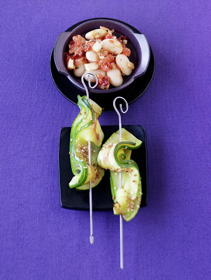 Courgette And Sesame Skewers With Spicy Lima Beans Photograph by Jalag / Janne Peters