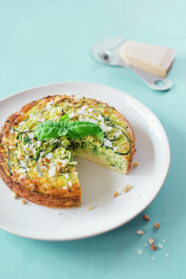 Courgette Cake With Parmesan And Pine Nuts Photograph by Jan Wischnewski