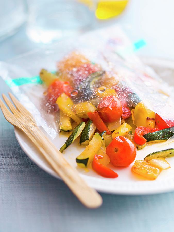 Courgette, Cherry Tomato, Pepper And Onion Papillote Photograph by Roulier-turiot