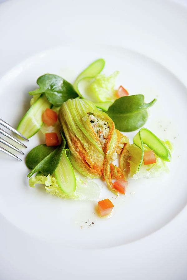 Courgette Flowers Filled With Prawn Tartare And Vegetable Couscous Photograph by Michael Wissing