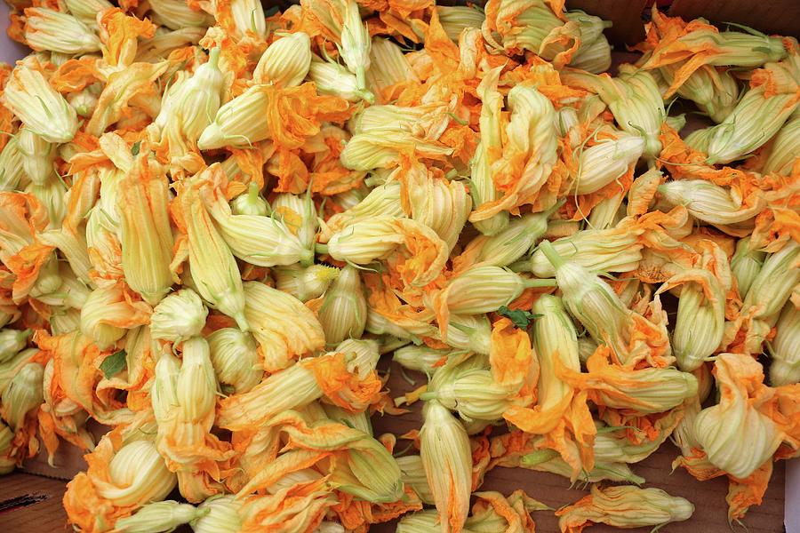 Courgette Flowers In A Box At A Market Photograph by Bayle Doetch