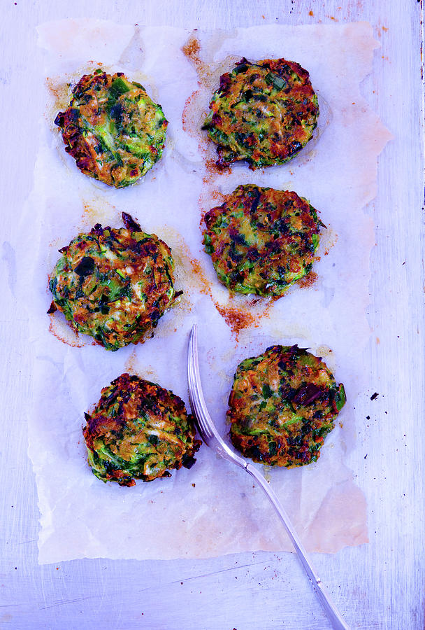 Courgette Fritters On Parchment Paper Photograph by Udo Einenkel