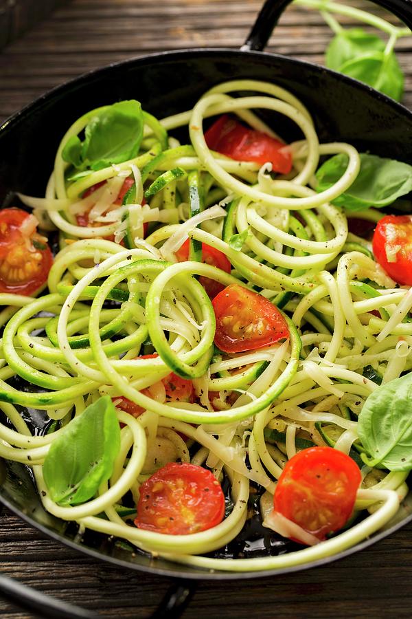 Courgette Noodles With Sauted Cherry Tomatoes And Basil Photograph by Sandra Krimshandl-tauscher