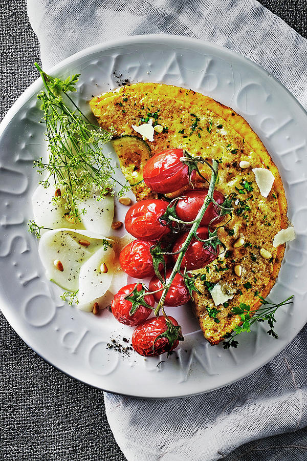 Courgette Omlette With Herbs, Tomatoes, Kohlrabi Carpaccio And Dill Flowers Photograph by Manfred Rave