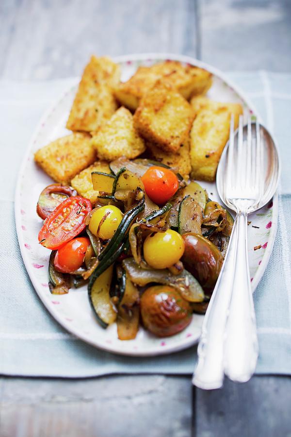 Courgettes With Polenta Chunks And Tomatoes Photograph by Sporrer ...