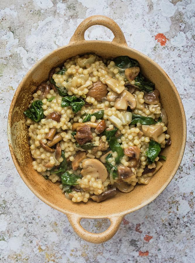 Couscous Risotto With Wild Mushrooms, Spinach And Chestnuts Photograph by Lucy Parissi