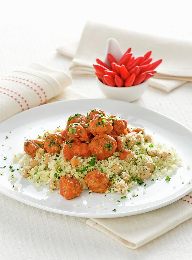 Couscous With Meatballs In Tomato Sauce Photograph by Franco Pizzochero