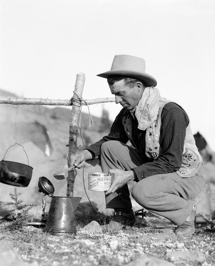 Cowboy Kneeling By Campfire, Pouring Photograph by H. Armstrong Roberts