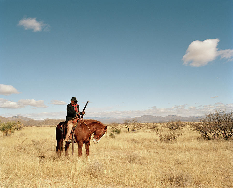 Cowboy Riding On Horse Photograph by Matthias Clamer