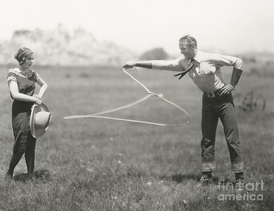 1920s Photograph - Cowboy Showing Off His Roping Skills by Everett Collection 1920s Photograph - Cowboy Showing Off His Roping Skills by Everett Collection