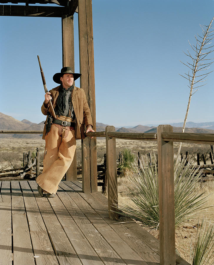 Cowboy Standing On Porch Photograph by Matthias Clamer