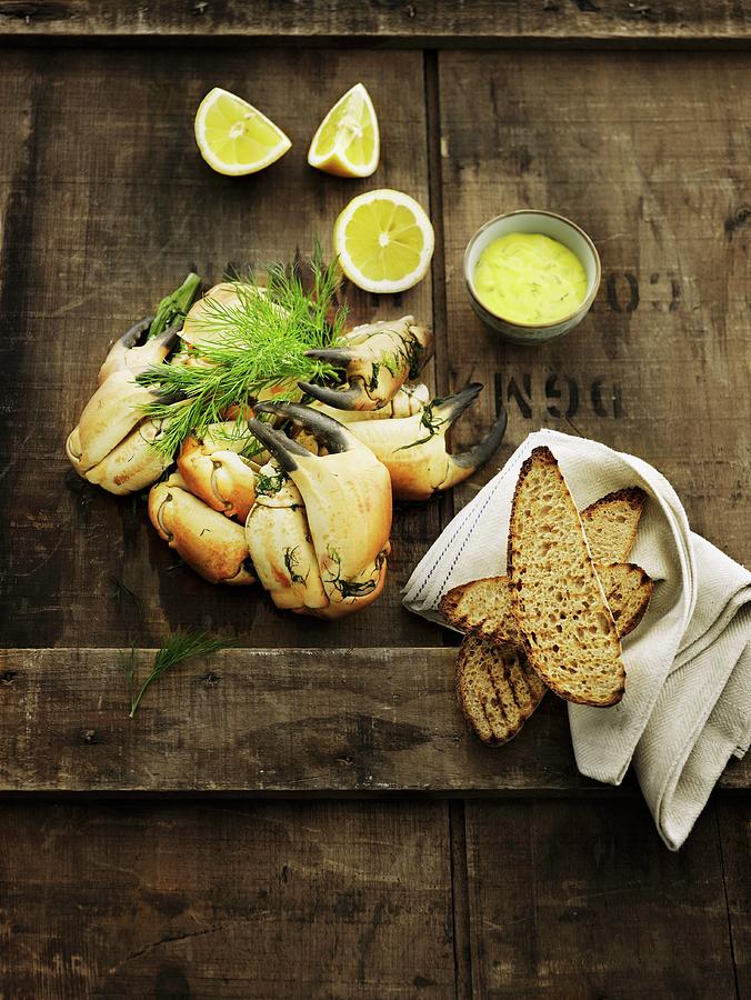 Crab Claws With Grilled Bread And A Lemon Dip Photograph by Mikkel Adsbl