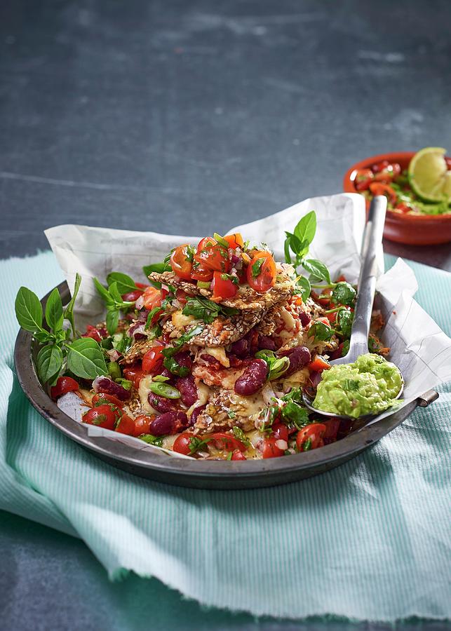 Cracker Nachos With Tomato, Kidney Beans, Mozzarella And Guacamole Photograph by Great Stock