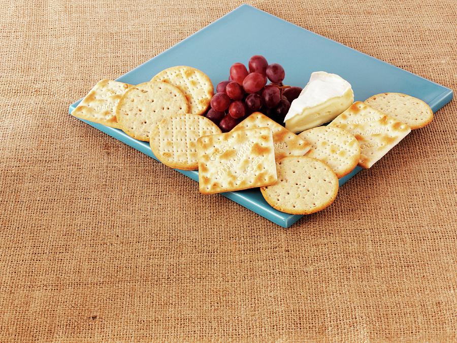 Crackers, Camembert Cheese And Grapes Photograph by Frank Adam