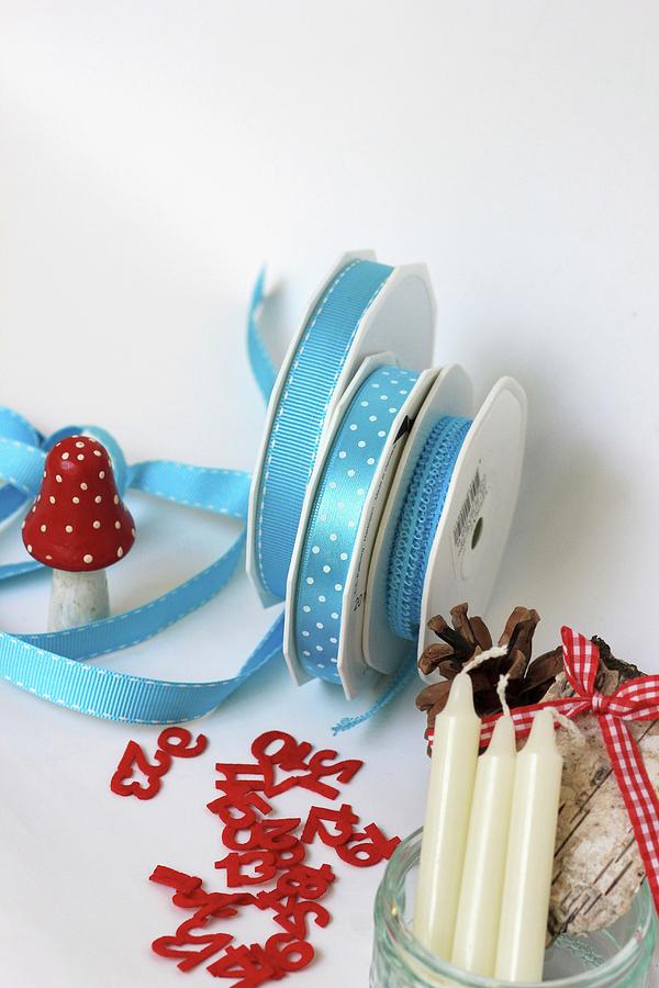 Craft Utensils & Decorations: Ribbons, Decorative Numbers, Toadstool Ornament, Pine Cones & Candles Photograph by Ruth Laing