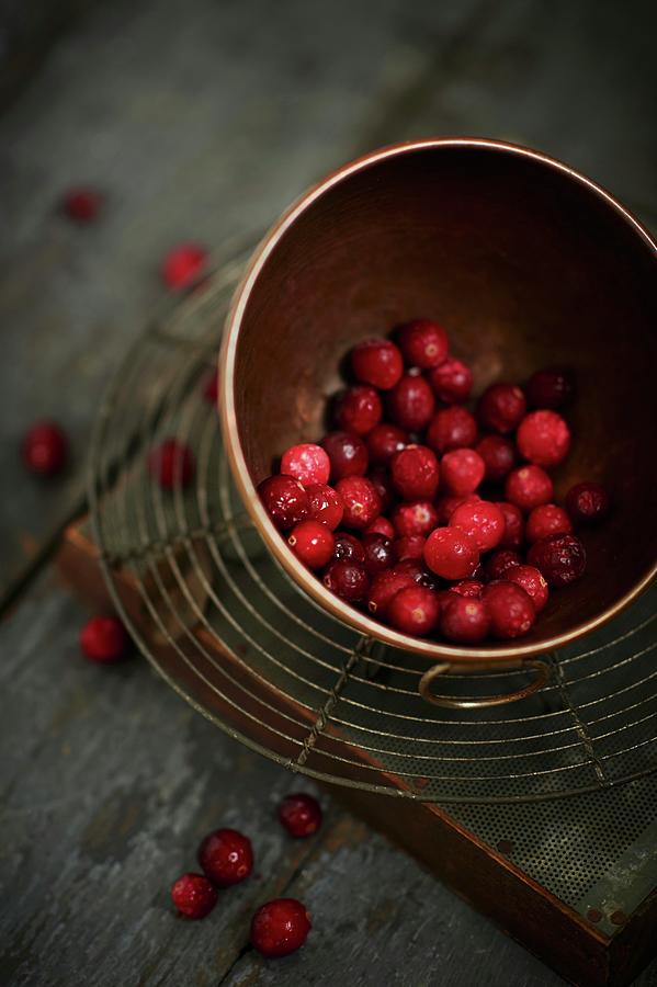 Cranberries In A Copper Bowl Photograph by Greg Rannells