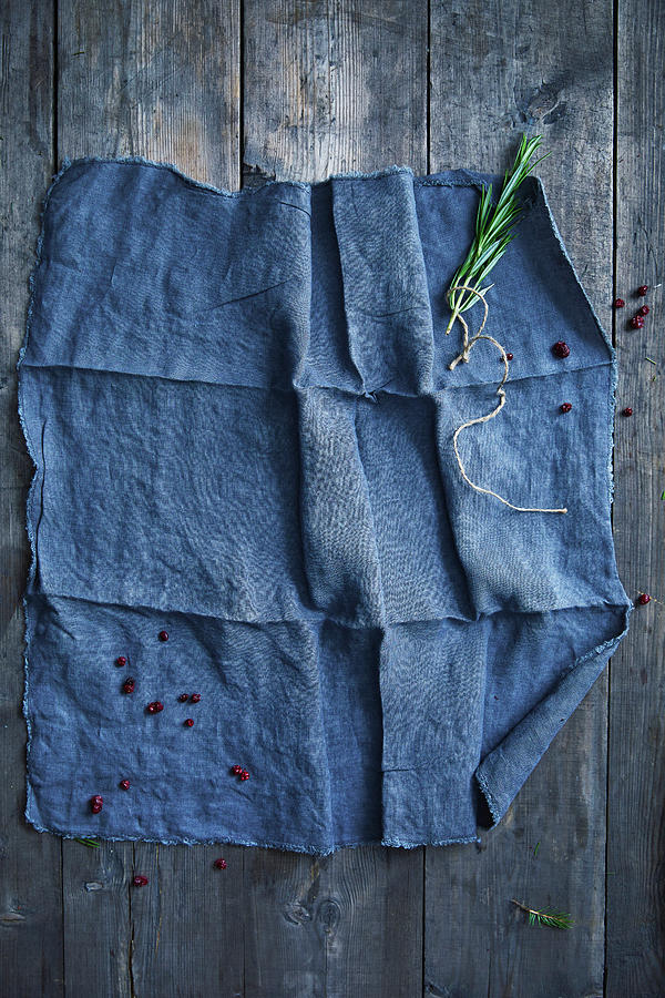 Cranberries On A Blue Cloth Photograph by Aina C. Hole