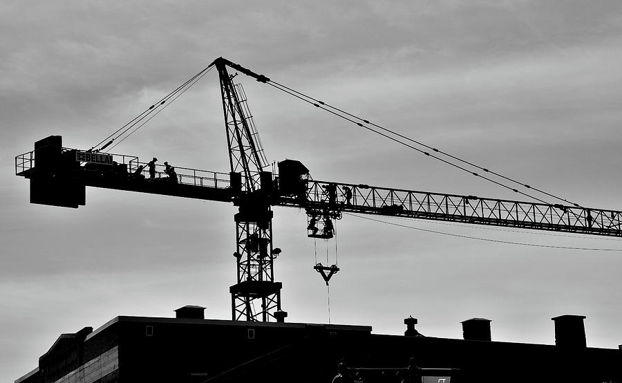 Crane and Men Skyline Photograph by Jeremy Hall