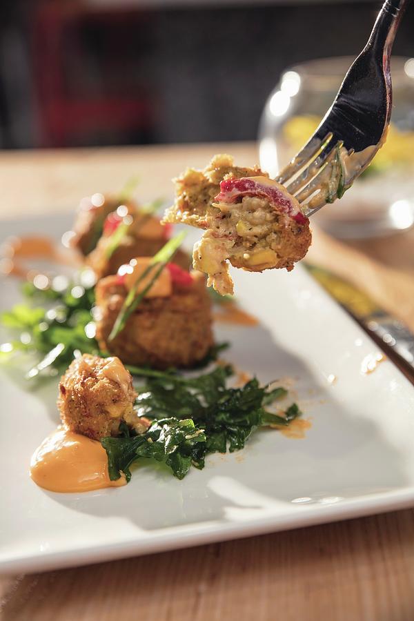 Crawfish Corn Fritters On A Fork And Plate Photograph by Cindy Haigwood ...