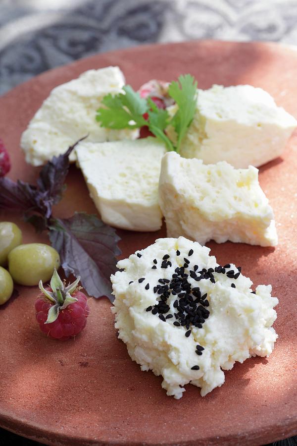 Cream Cheese With Black Sesame Seeds, Feta Cheese, Olives And Raspberries Photograph by Barbara Lutterbeck