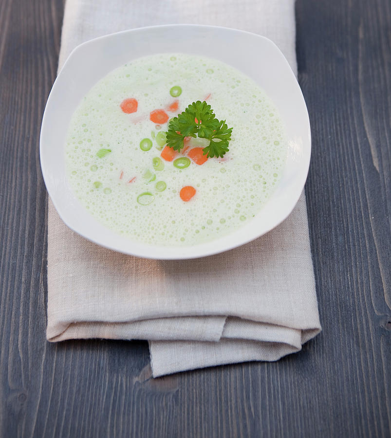 Cream Foam Soup With Spring Onions, Carrots And Parsley Photograph by Jennifer Braun