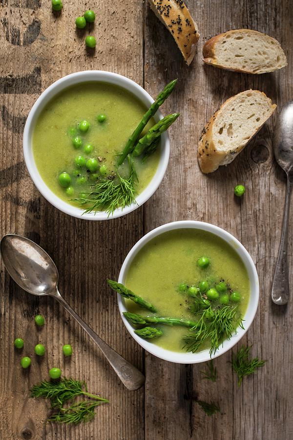 Cream Of Asparagus And Pea Soup Garnished With Peas. Fresh Asparagus And Dill Photograph by Magdalena Hendey
