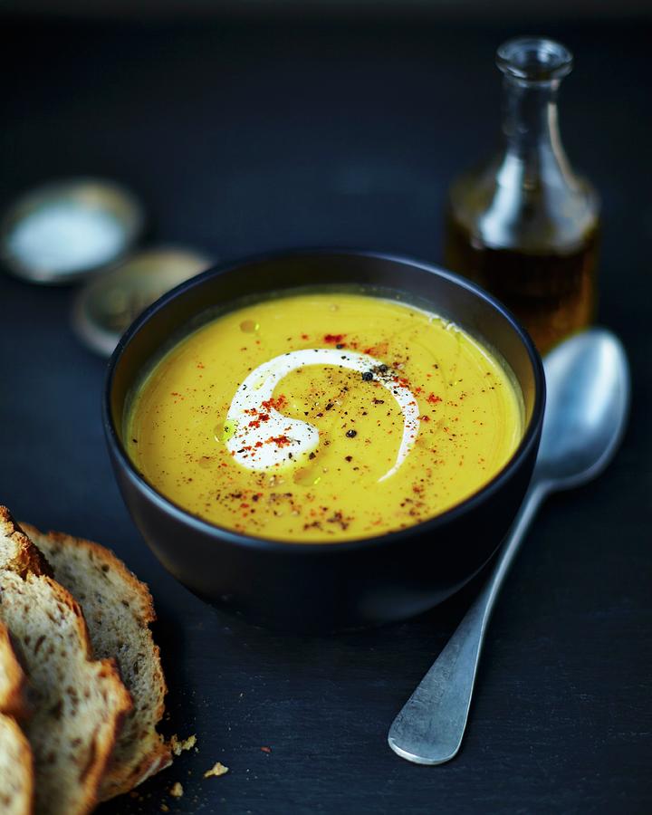Cream Of Butternut Squash Soup With Bread Photograph by Tom Regester