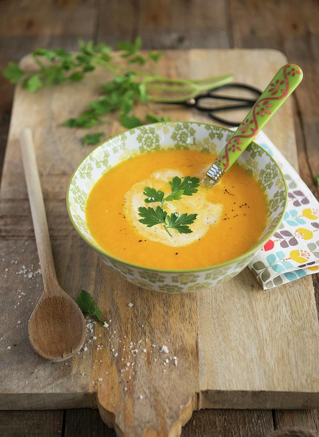 Cream Of Carrot Soup With Parsley Photograph by Sonia Chatelain