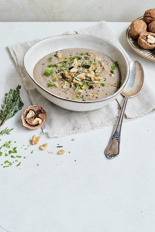 Cream Of Mushroom Soup With Chestnuts And Walnuts Photograph by Brigitte Stockfood Studios / Sporrer