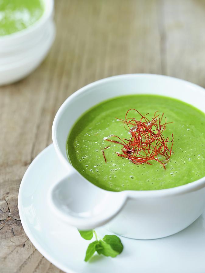 Cream Of Pea Soup With Chilli Threads Photograph by Michael Lffler