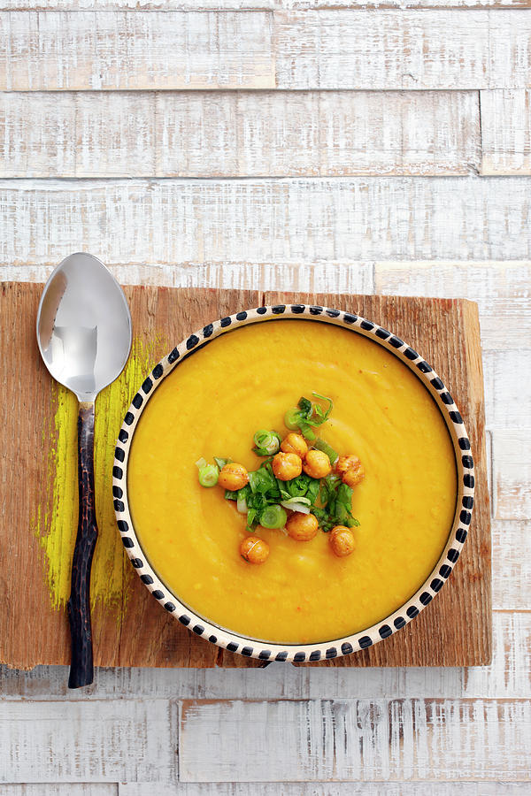 Cream Of Pumpkin Soup With Chickpeas And Spring Onions seen From Above Photograph by Petr Gross