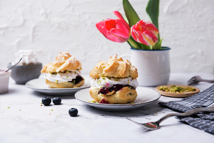 Cream Puffs With Soy Whipped Cream, Blueberry Compote And Pistachios Photograph by Kati Neudert
