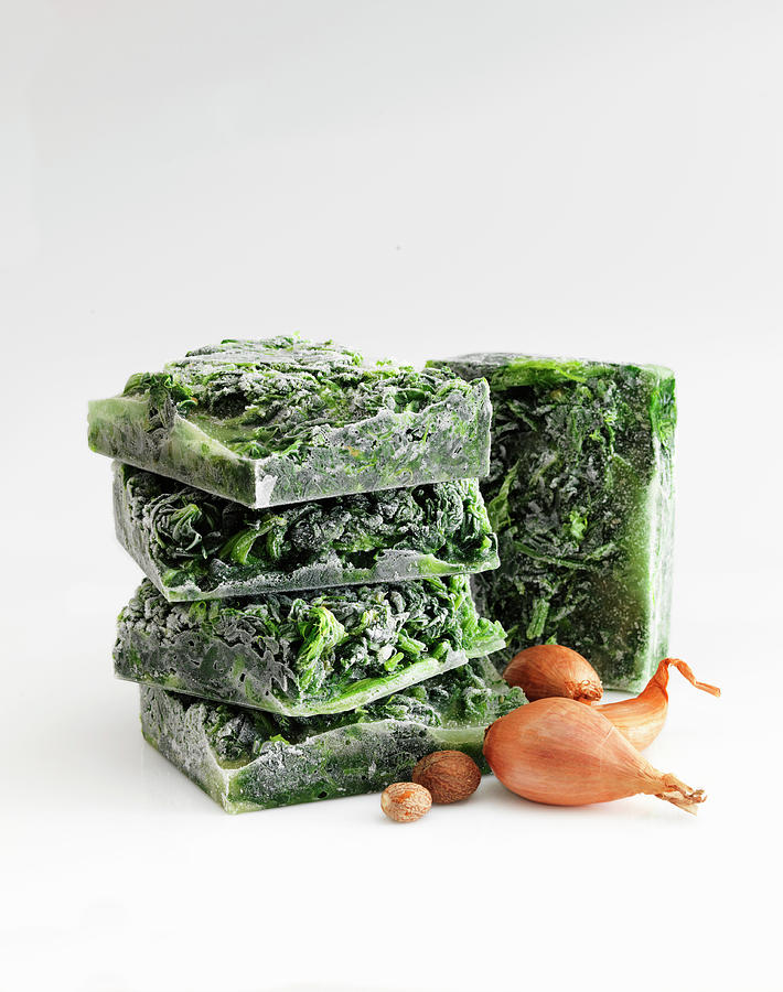 Creamed Spinach, Frozen In Blocks Against A White Background Photograph by Jim Scherer