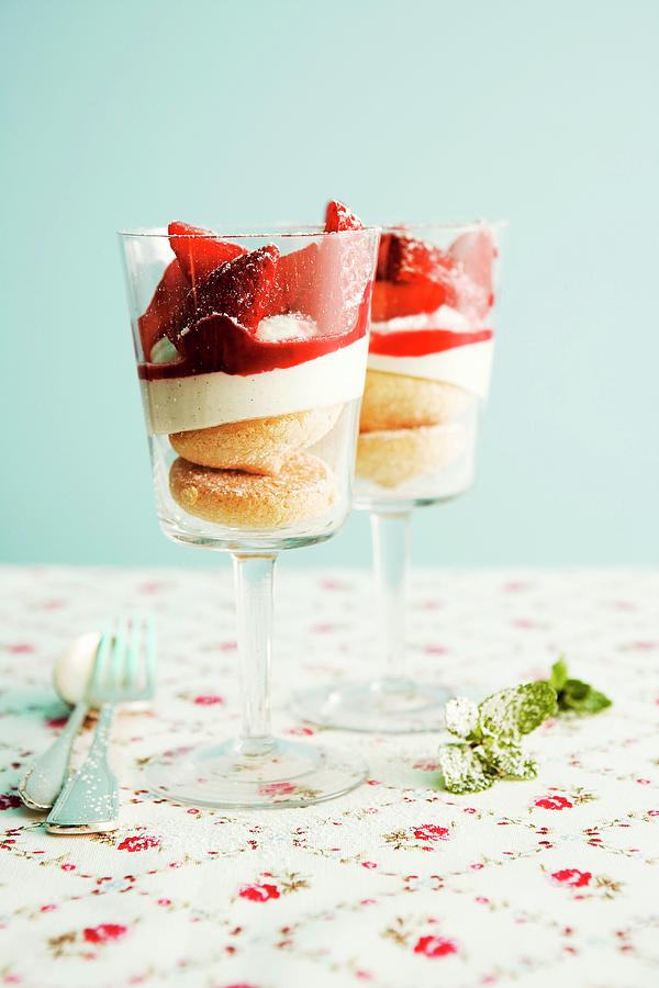 Creamy Cheesecake With Strawberries In Glasses Photograph by Michael Wissing