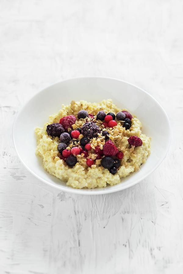 Creamy Millet Porridge With Berries And Nuts Photograph by Malgorzata Laniak