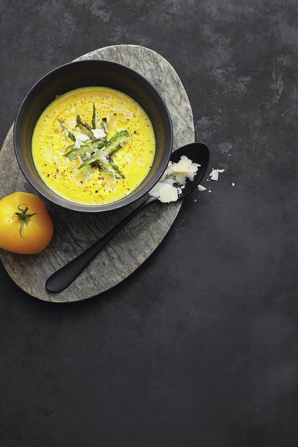 Creamy Yellow Tomato Soup With Saffron And Green Asparagus Photograph by Jalag / Mathias Neubauer