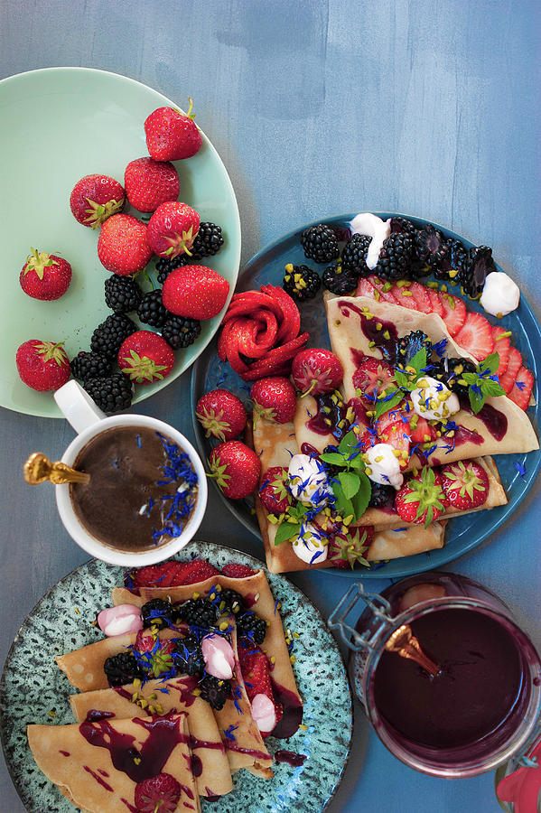 Crepes With Jam, Berries And Pistachios Photograph by Elena Ecimovic