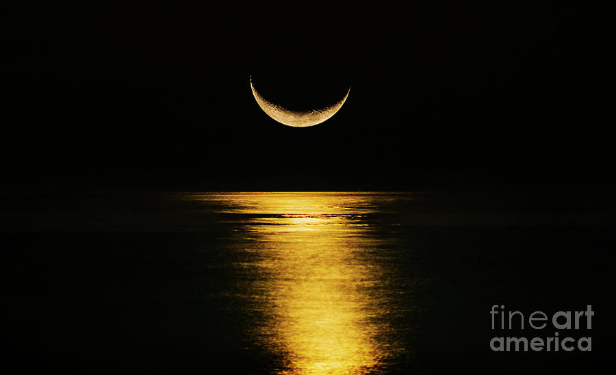 Crescent Moon Reflecting In Sea Photograph by Tetra Images