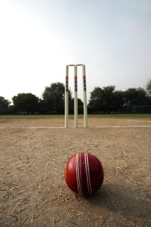 Cricke Ball Aand Wickets On A Pitch Photograph by Visage