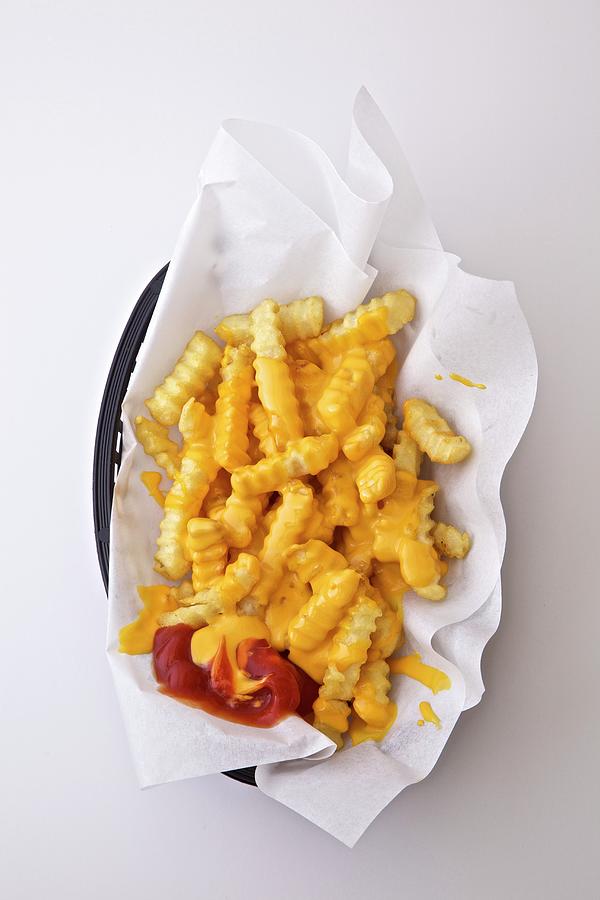 Crinkle Cut Chips With Melted Cheese And Ketchup Photograph by Andre Baranowski