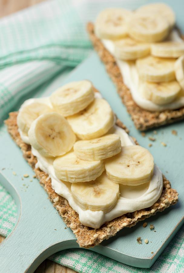 Crisp Bread Topped With Cream Cheese And Bananas Photograph by Jonathan Short
