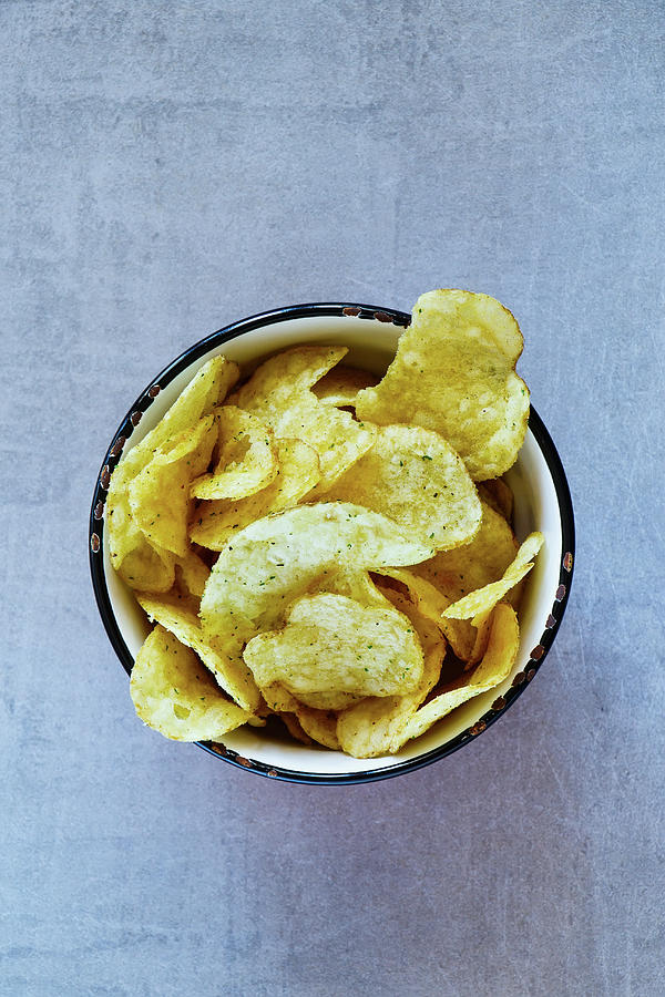 Crisps In A Vintage Cup seen From Above Photograph by Yuliya Gontar