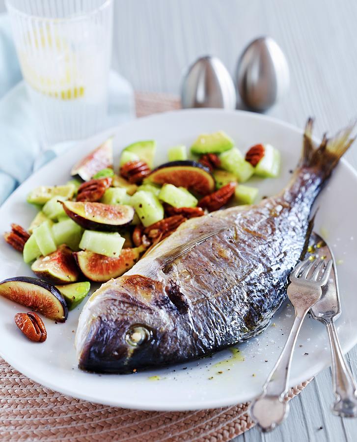 Crispy Baked Sea Bream With Cucumbers, Figs And Pecan Nuts Photograph by Charlie Richards