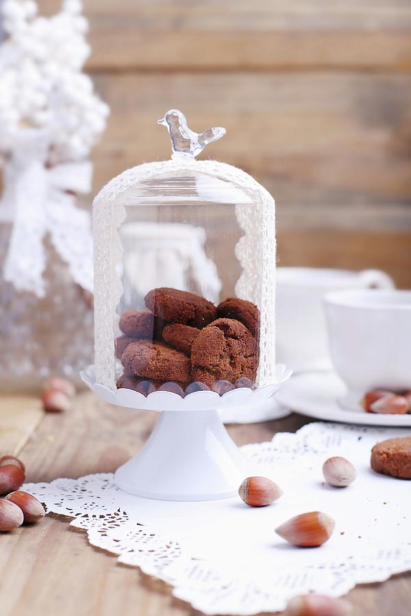 Crispy Chocolate And Hazelnut Biscuits Under A Glass Cloche Photograph by Natalia Mantur
