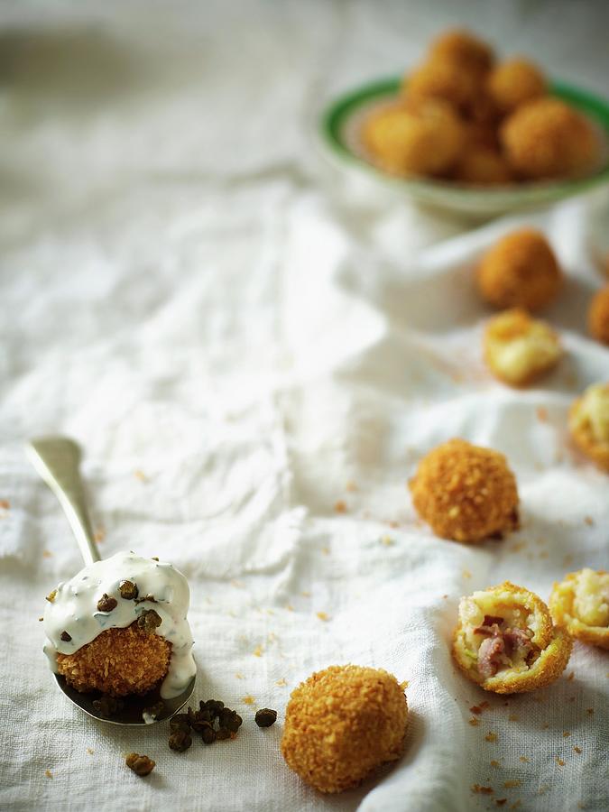 Crispy Fried Potato Balls Filled With Bacon Served With A Quark Dip Photograph by Great Stock!