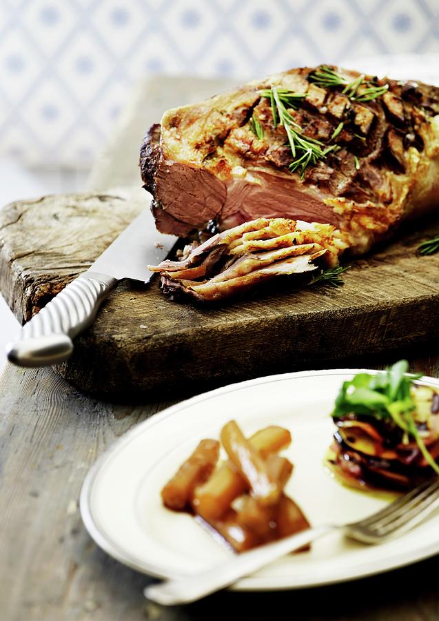 Crispy Roast Beef With A Mustard Crust On A Chopping Board, Partially Sliced Photograph by Mikkel Adsbl