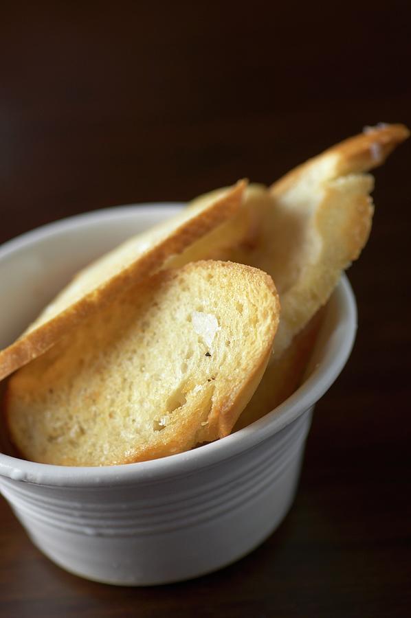 Crispy Slices Of Garlic Bread Photograph by Tim Green