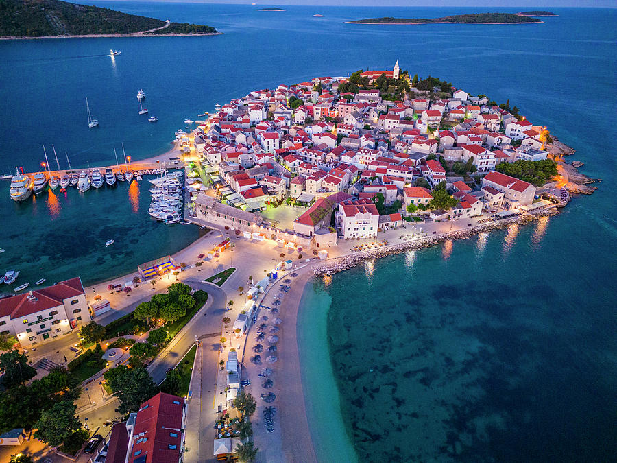 Croatia, Dalmatia, Primosten, Mediterranean Sea, Adriatic Coast, Aerial View Of Peninsula On Which The Old Town Of Primosten Stands And The Beaches At The Blue Hour Before Sunrise Digital Art by Manfred Bortoli